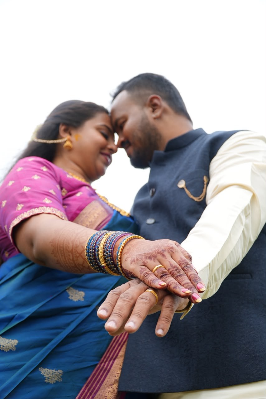 Pradeep and Ananya with their hands together showing their rings